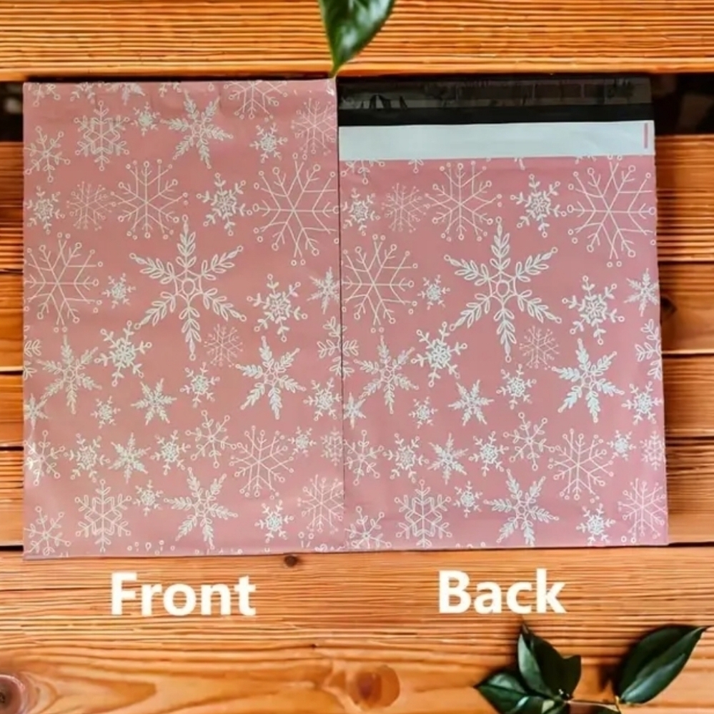 Ten pink with white snowflakes poly mailers